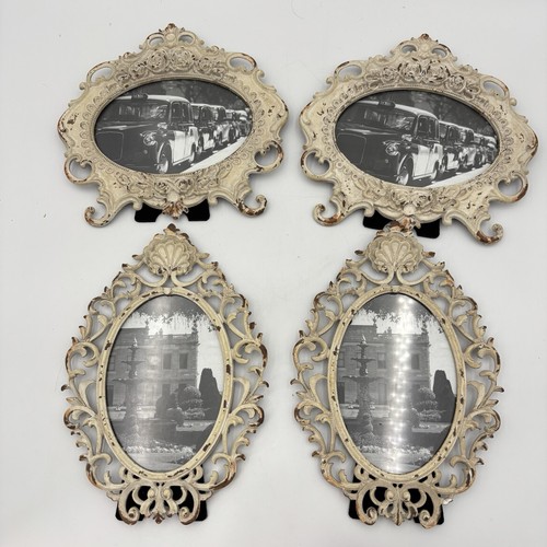 Four ornate metal frames - four,
